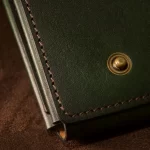 Machine stitched green leather wallet